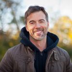 Portrait of A Mature Man Smiling At The Park